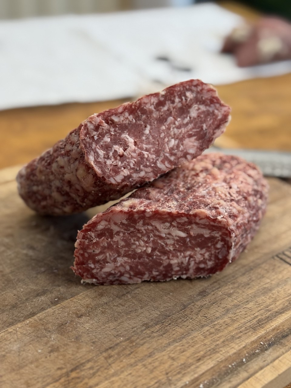 Genoa salami sliced in half.